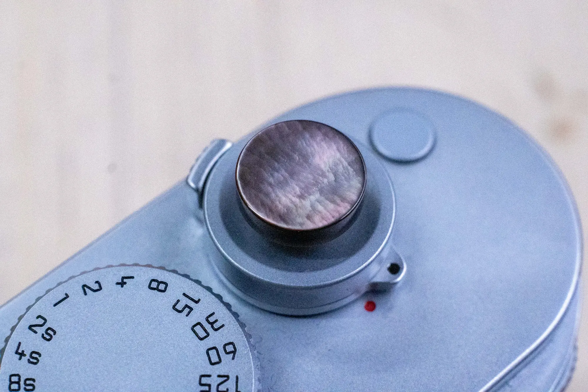 Mother-of-pearl camera shutter button and hot shoe cover